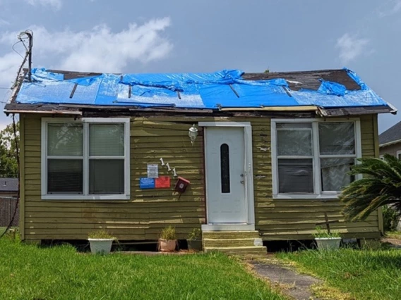 Photo of blue tarp on a home in North Lake Charles in August 2022. 